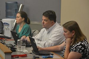 Three adults in attending a the CMC Project Team Leadership course at UW-Madison