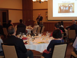 Eyal Barash presenting at the opening dinner of the 2018 June Land O' Lakes