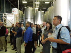 Participants at August Land O' Lakes tour the Wisconsin Brewing Company