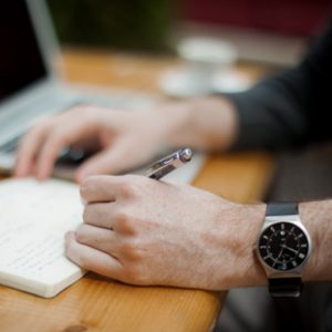 Healthcare professional taking notes for formulary drug evaluation