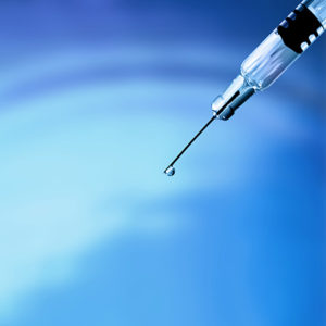 dripping hypodermic needle